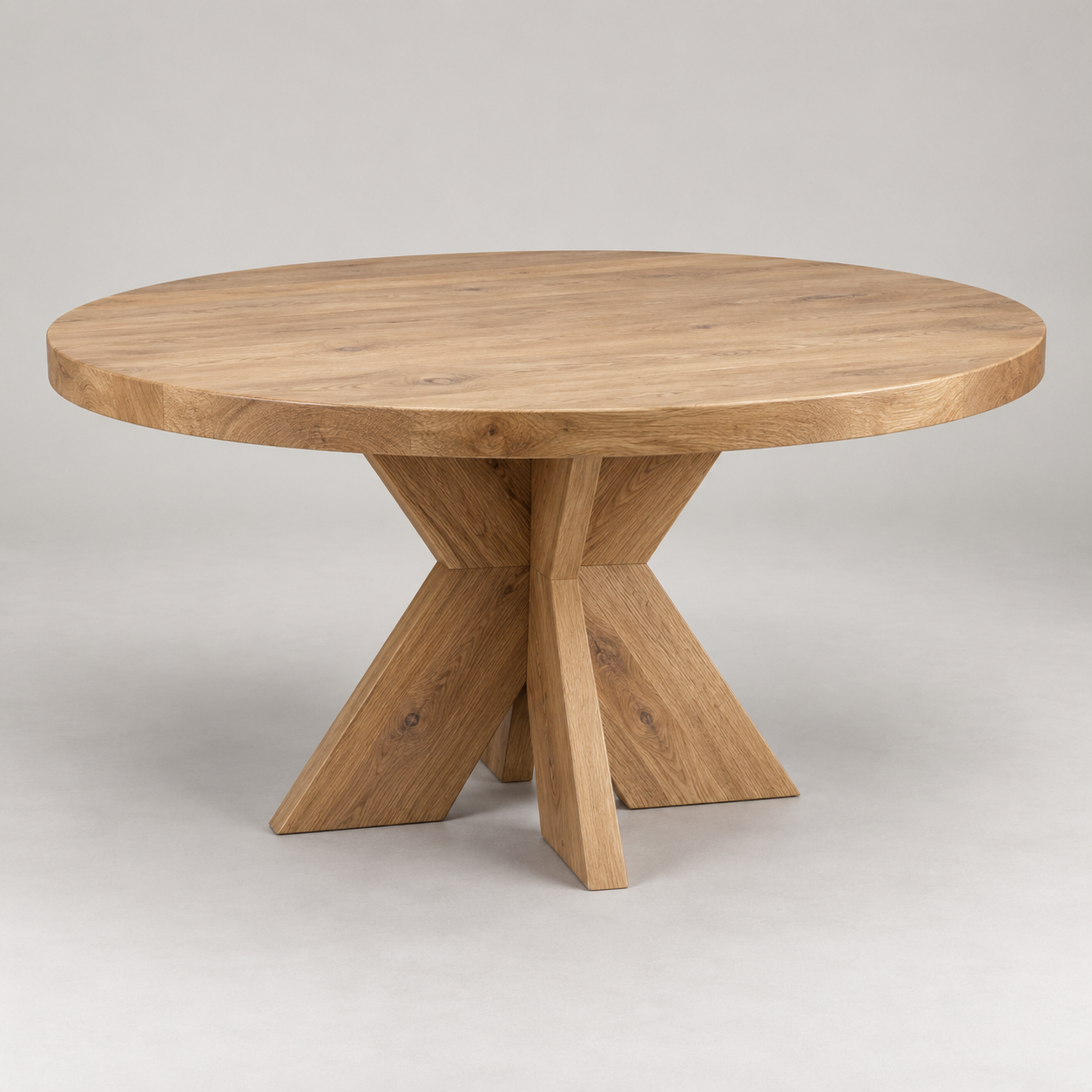 Cala Round Dining Table on a pale studio background