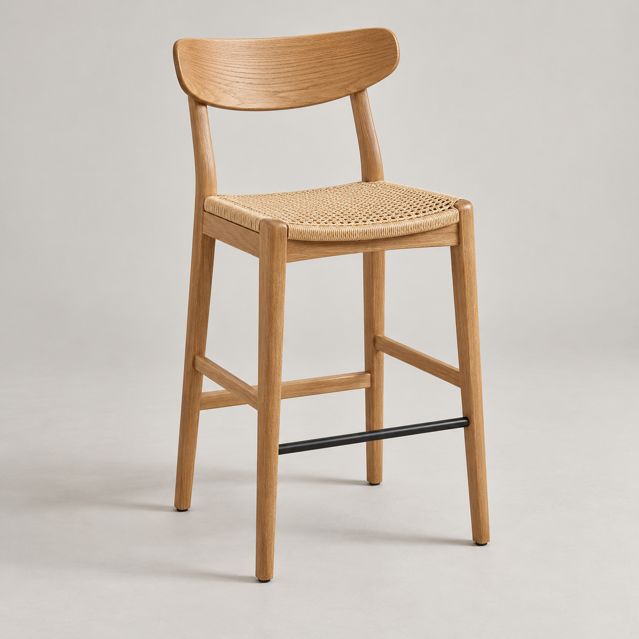 Junco Counter Stool on a pale studio background