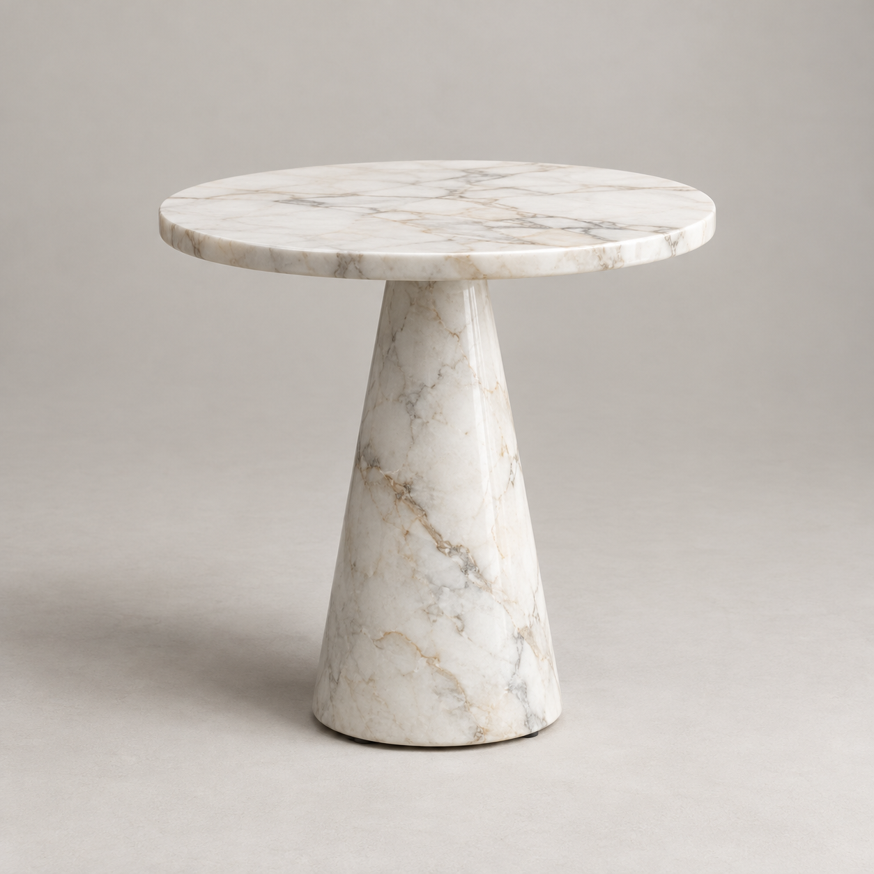 Piedra Marble Side Table on a pale studio background